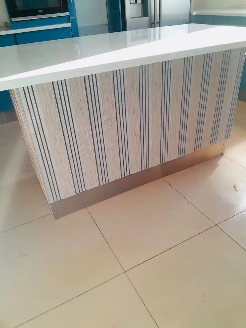Island panel with a vertical striped finish and a white top