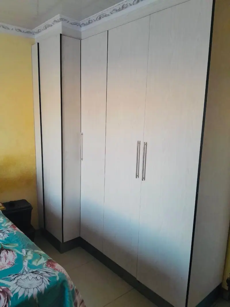 Tall cream wardrobe doors with long handles